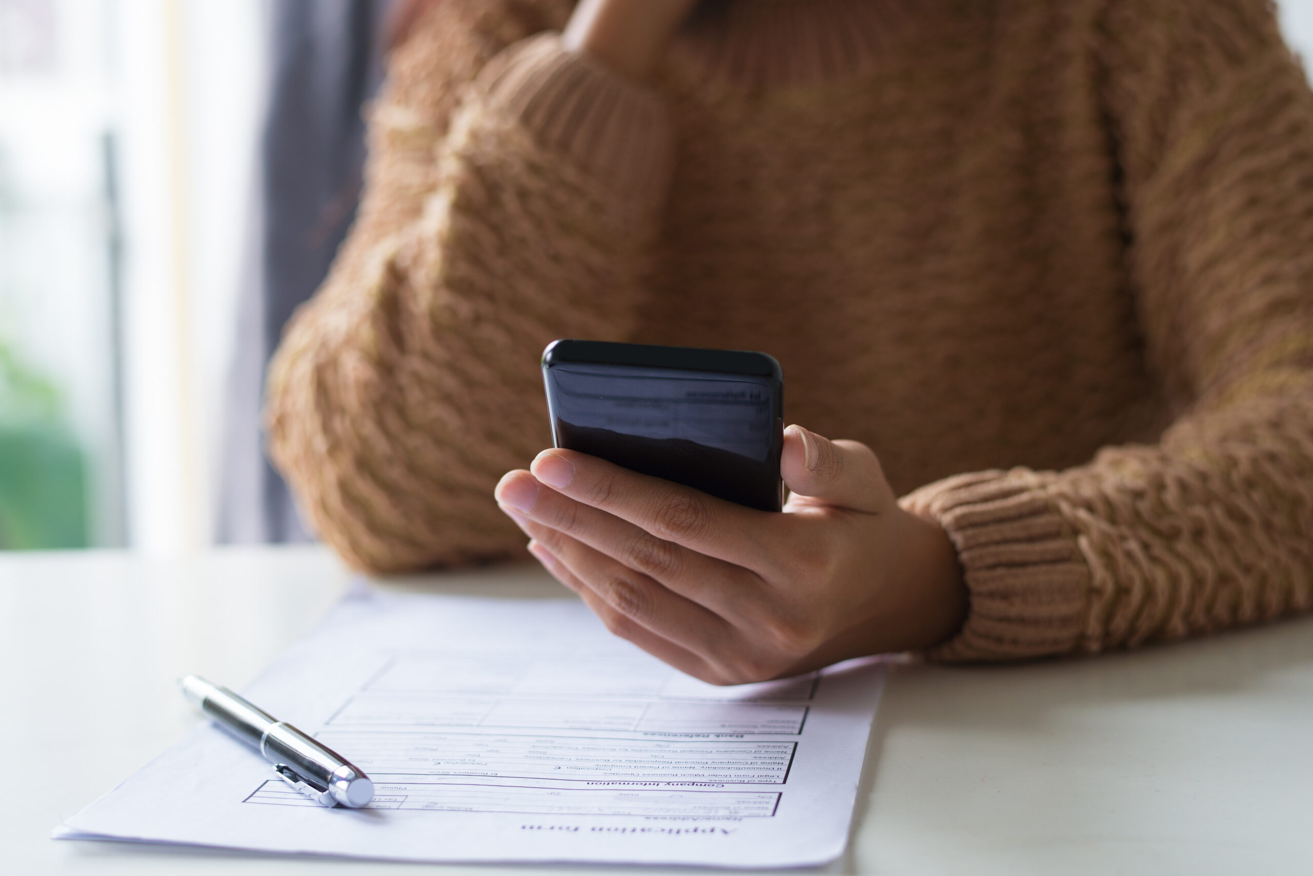 A female business owner submitting a trademark application