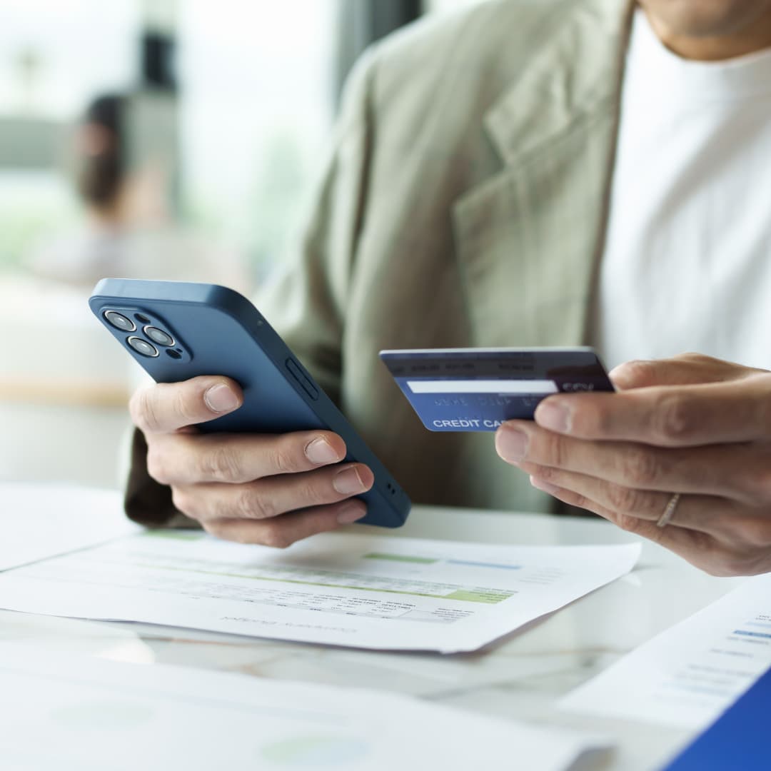 Man putting credit card information into an online shopping app